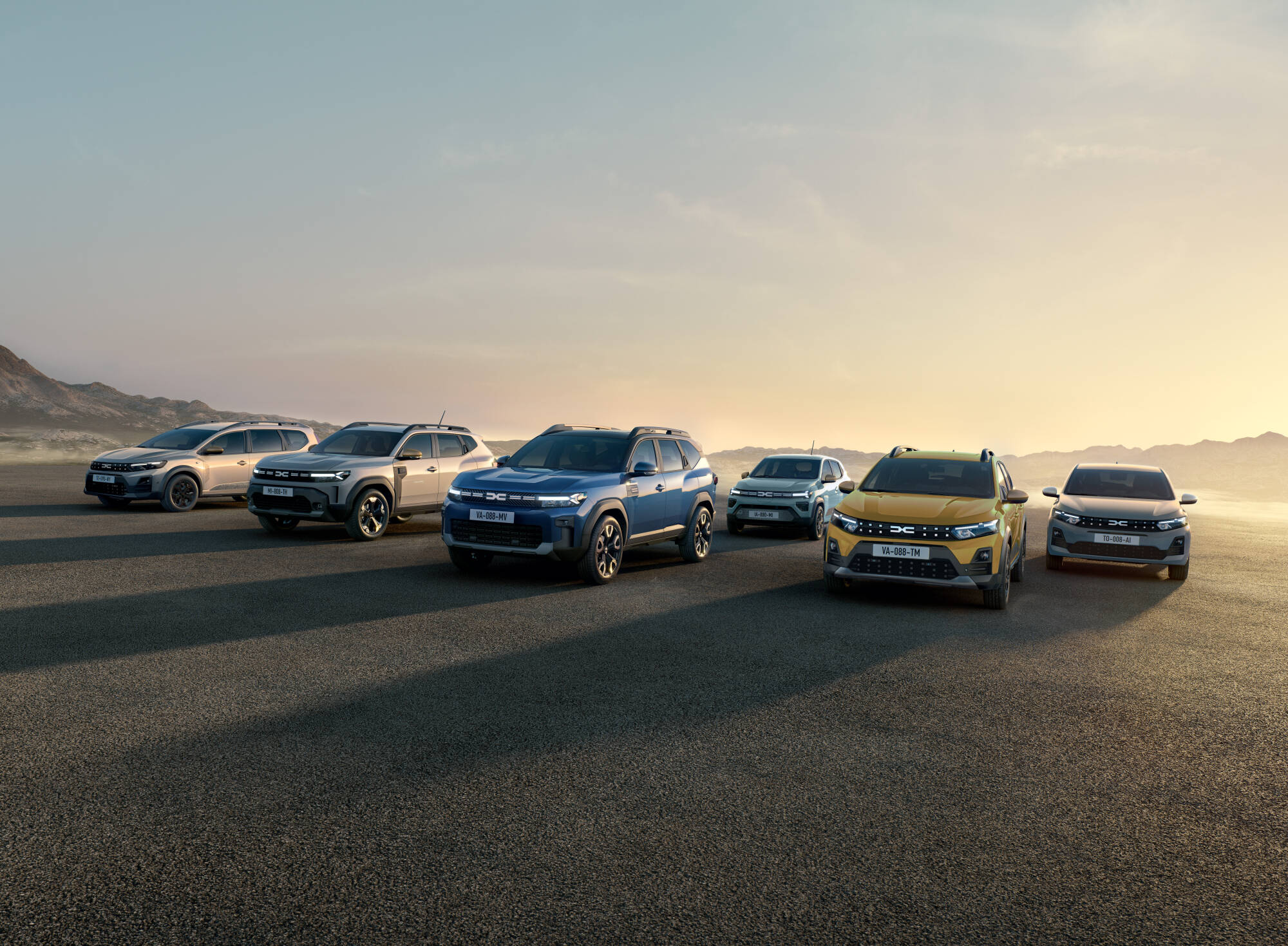 Gama Dacia 2026 fotografada em planalto árido ao amanhecer, com Bigster, Duster, Jogger, Sandero e Spring
